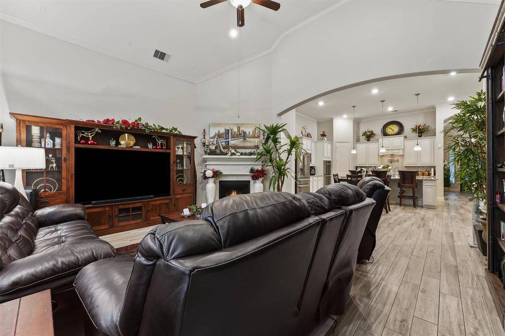 Gas log fireplace and cast stone mantle make this space feel cozy