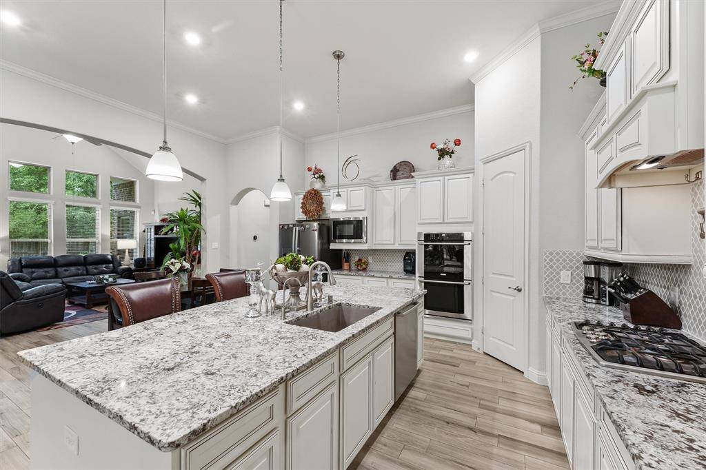 Notice the piping accents on the cabinet doors and drawers. The double oven will make cooking a breeze!