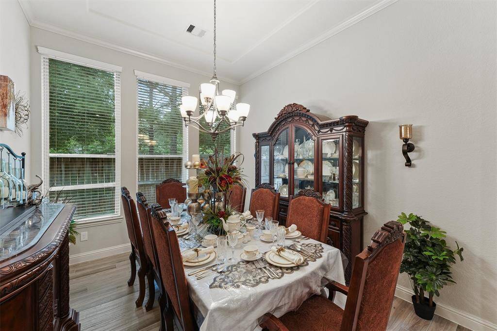Formal dining room with a shallow tray ceiling and plenty of room for a table of 8!