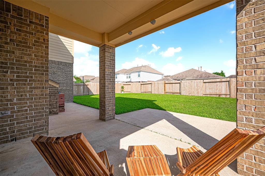This dream backyard space offers a perfect blend of relaxation and entertainment.Surrounded by well-maintained landscaping and natural elements