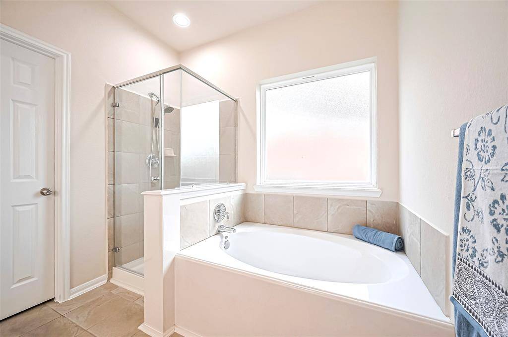 Plenty of natural light streams in through the window, brightening the space and enhancing its airy ambiance.