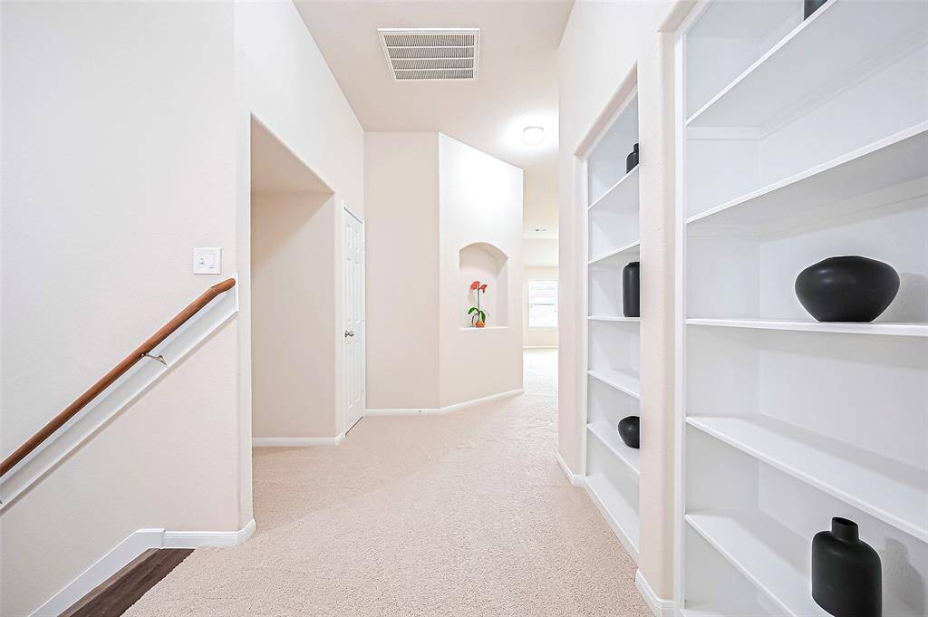Upstairs lobby with Stylish decorative shelves enhance the ambiance, providing the perfect display for books, artwork, or personal collectibles