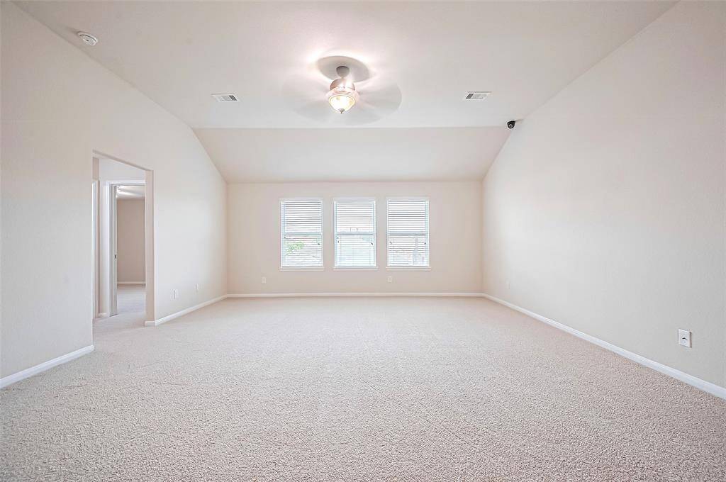 With ample natural light, a spacious layout, the room feels open and inviting
