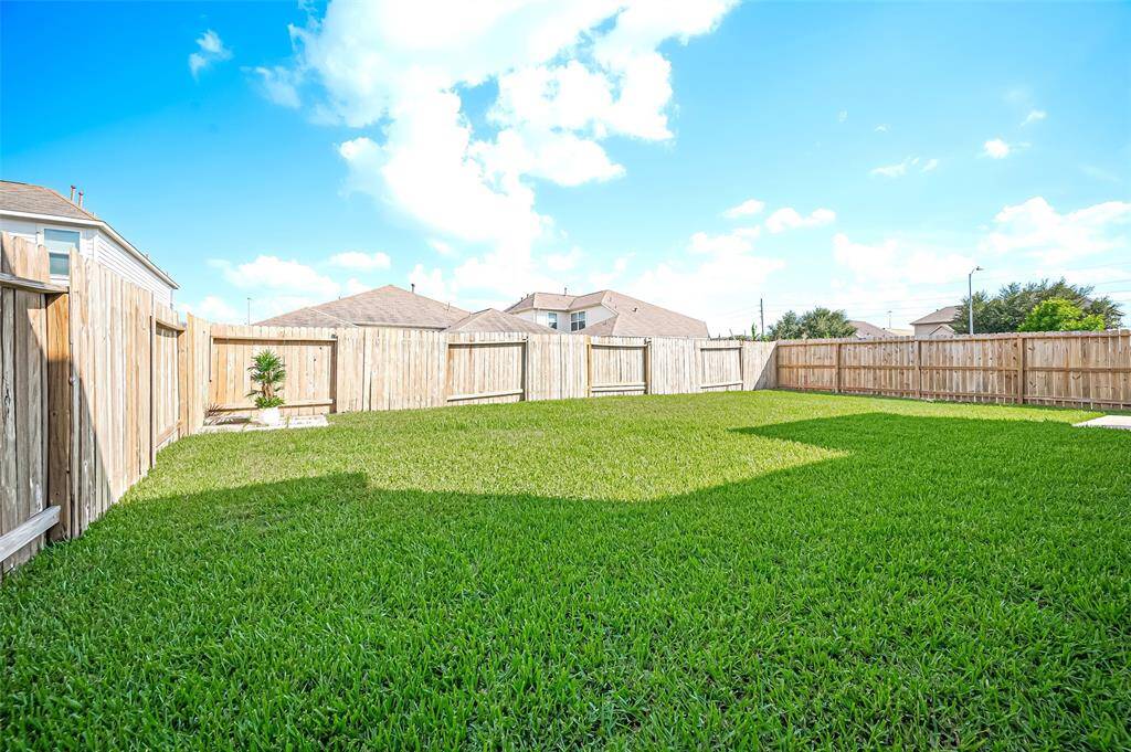 With plenty of space for kids to play, the backyard ensures a safe and fun environment for outdoor activities