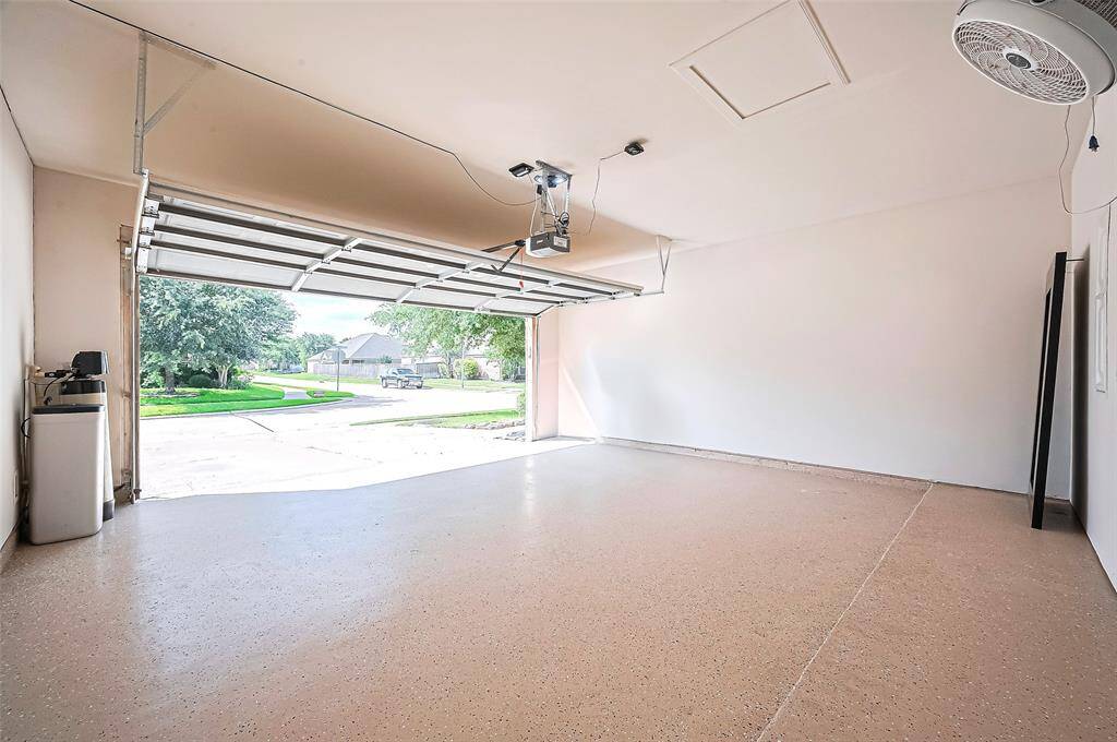 New epoxy-coated garage floor, providing durability and easy maintenance. Equipped with a RO water system