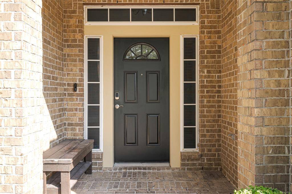Charming Brick-Paved entryway leads to the front door