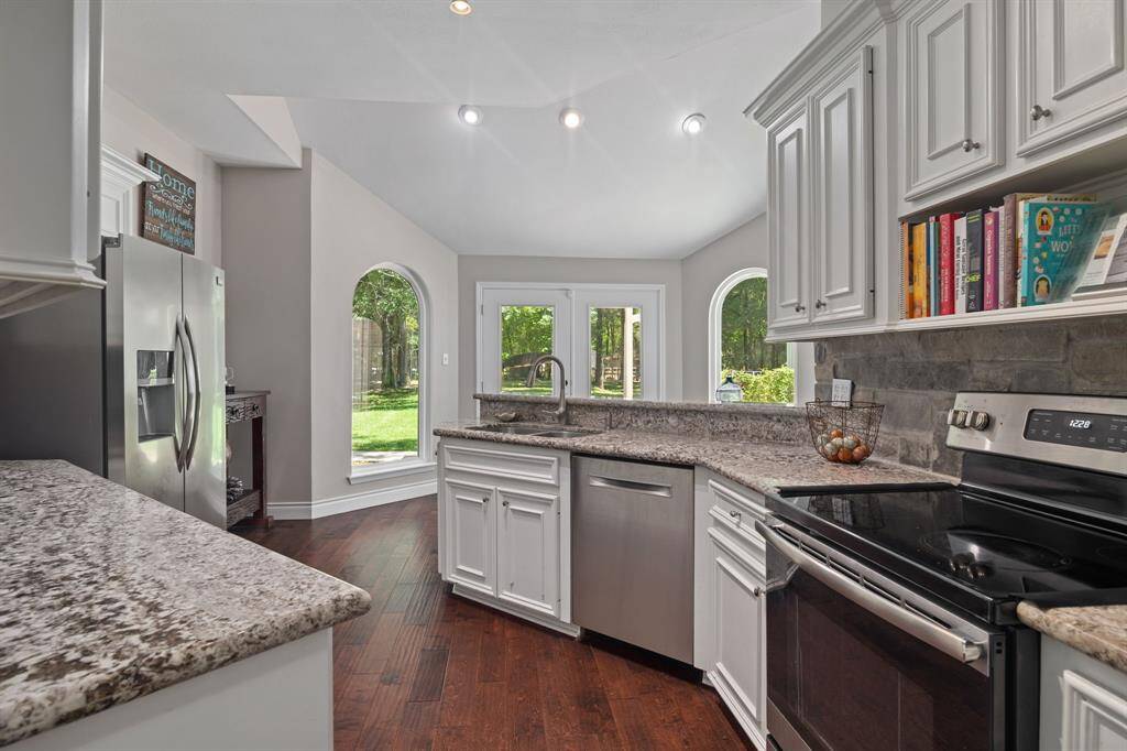 This light & bright kitchen also features an electric range & oven