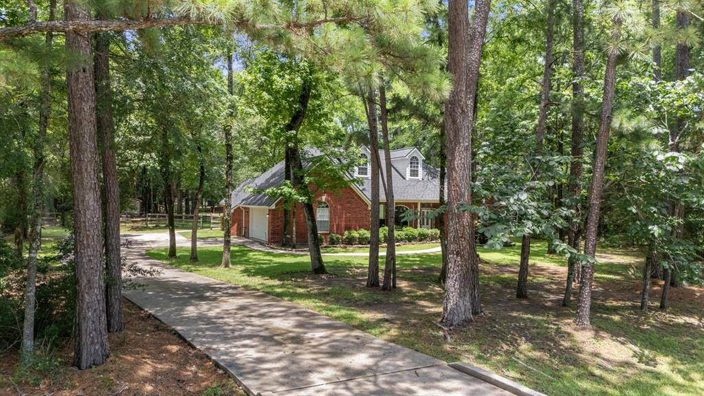 This charming brick home is nestled among tall trees offering a serene, wooded setting while providing a sense of privacy and tranquility. Perfect for nature lovers seeking a peaceful retreat.