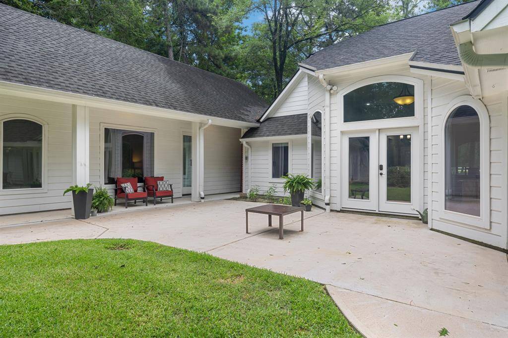 This photo showcases the spacious and inviting patio area. Guest House is ideal for rental, Airbnb, home office, MIL suite, home school, or hosting guests.