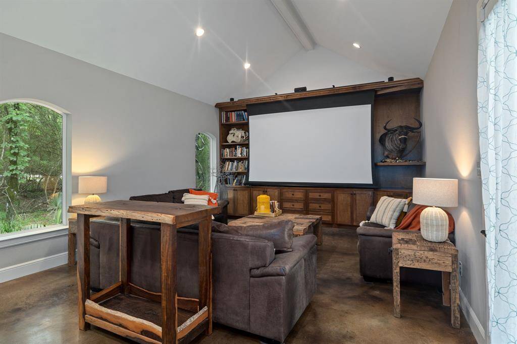 The 975 sqft Guest House  features polished concrete flooring, high ceilings and rich wooden built-in bookshelves & cabinets providing lots of storage.