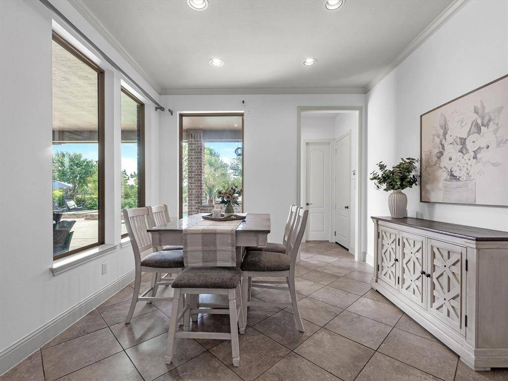 The kitchen nook with views of the back patio and pool