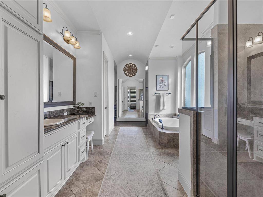 Two separate sinks with vanity space, a walk in shower and soaking tub.