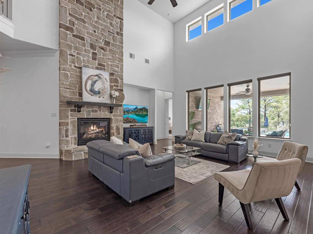 An exquisite fireplace centers the family room