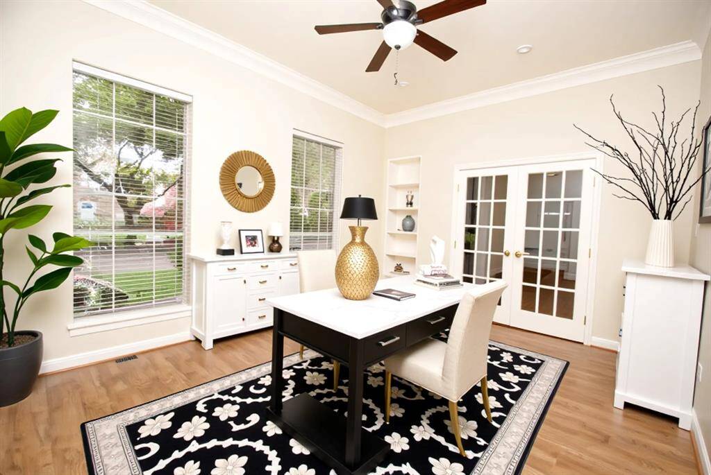 As you enter the home, the study is on the right with french doors, windows to make it light and airy and a ceiling fan to keep you cool. *room has been virtually staged*