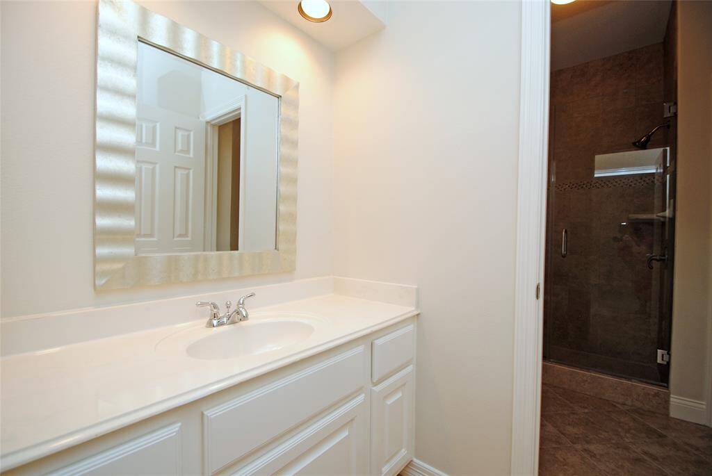 One of the two secondary bathrooms upstairs