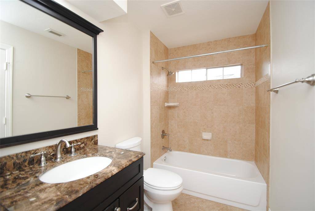 Secondary bathroom has been updated with a walk in shower