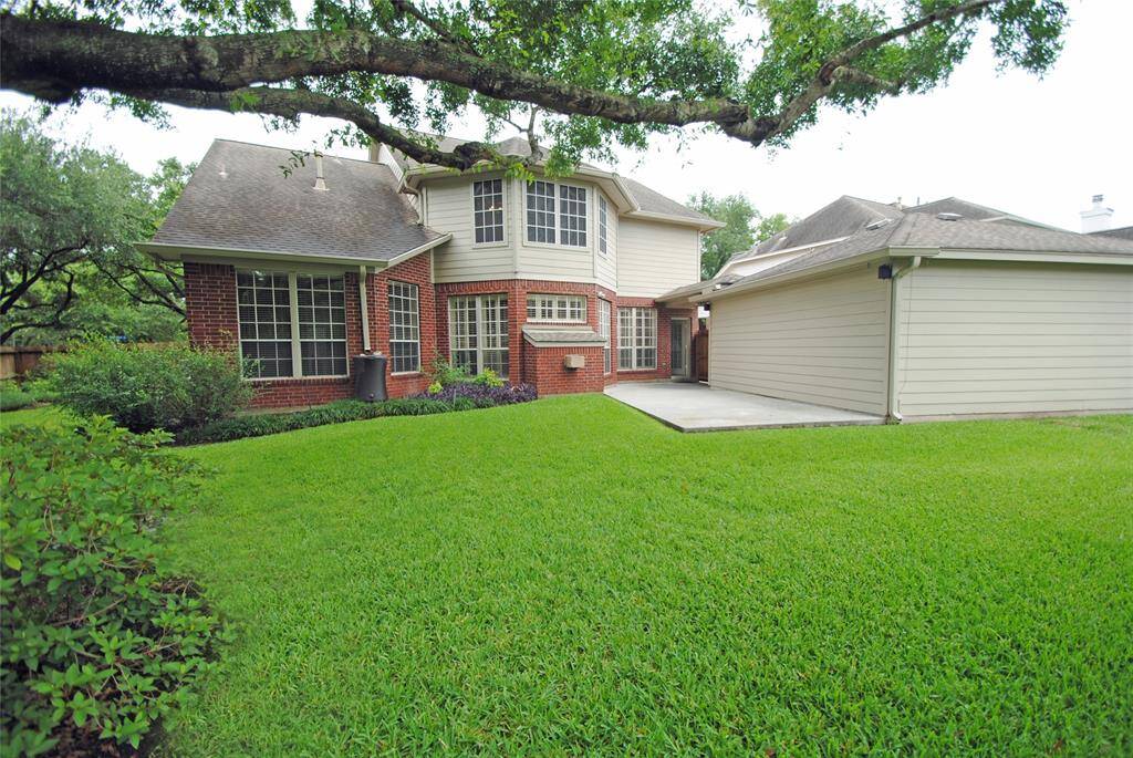 The back yard has plenty of room for the kiddos to run and play and offers a sizeable side yard.