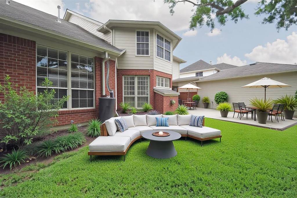 The back yard has an oversized patio ready for fun and games! *virtually staged*