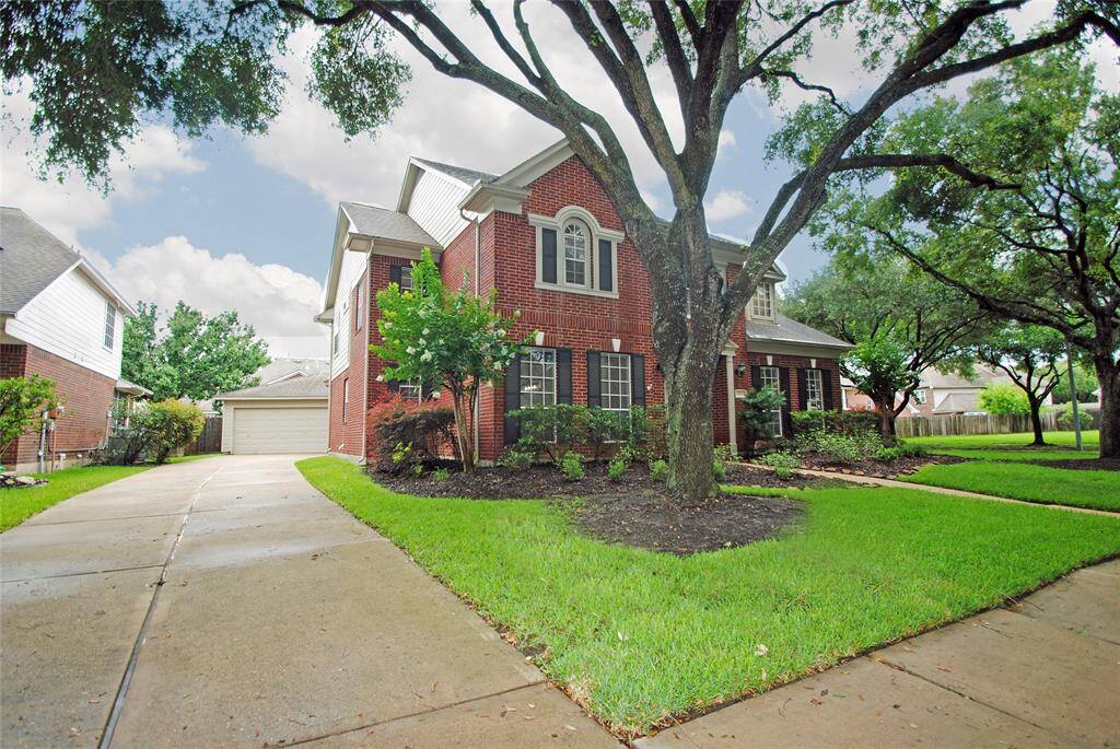 This home is located on a cul de sac and offers a double wide driveway and huge trees.