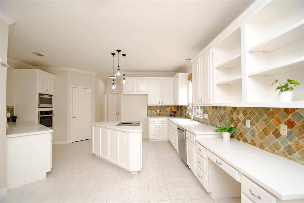 The heart of the home is the kitchen - plenty of room for all the cooks in the family!