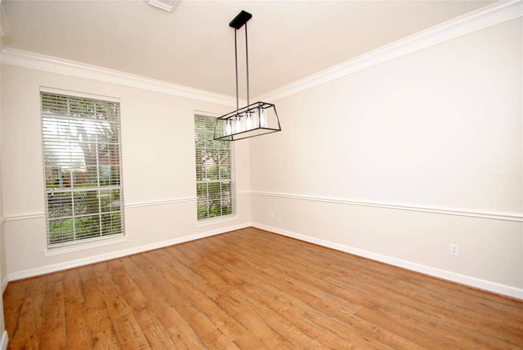 The dining room offers crown molding, new flooring and plenty of light and space for the whole family!