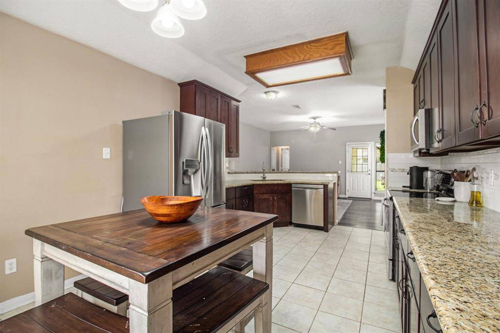 From the living area, you have easy access to the 2 bedrooms and hallway bath and to the outside patio.