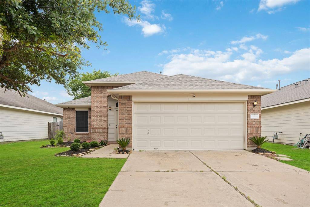 Curb appeal meets easy living with a double-wide drive, clean lines, and a recent roof already in place.