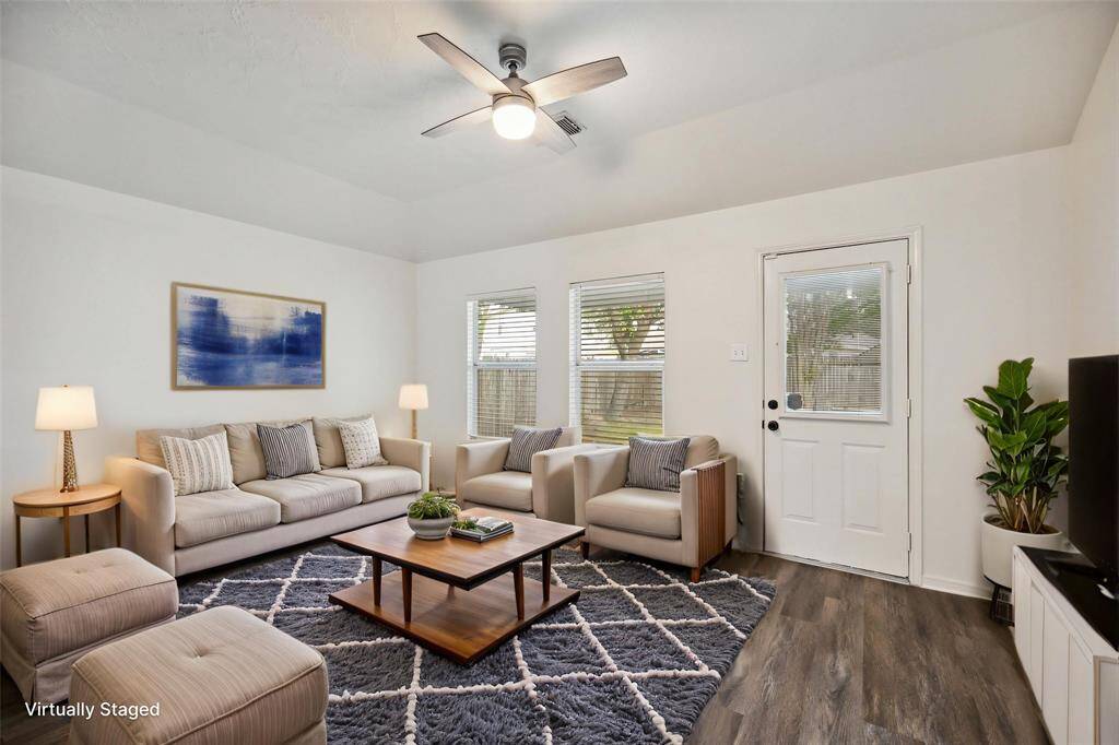 Settle in, stretch out—this bright, open living area is made for quiet mornings, cozy evenings, and everything in between.