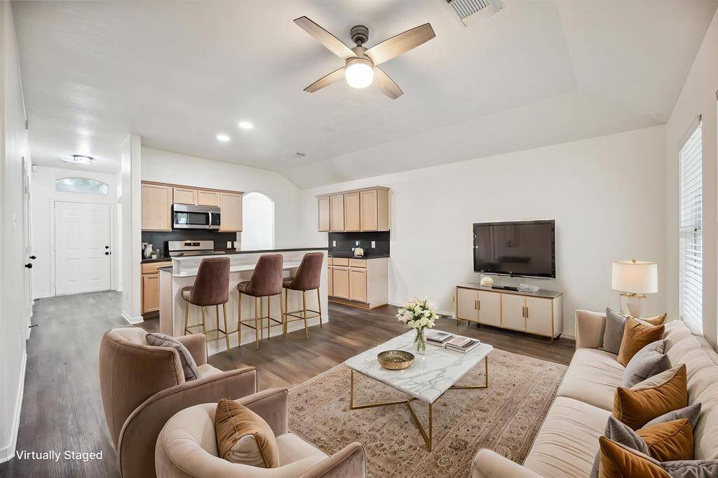 Effortless flow from kitchen to living to dining—it’s all open, all inviting, and designed to work with real life.