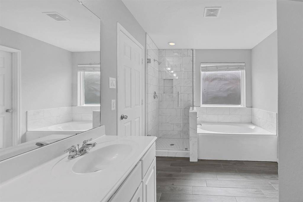 Shower upgraded with new tile and frameless door