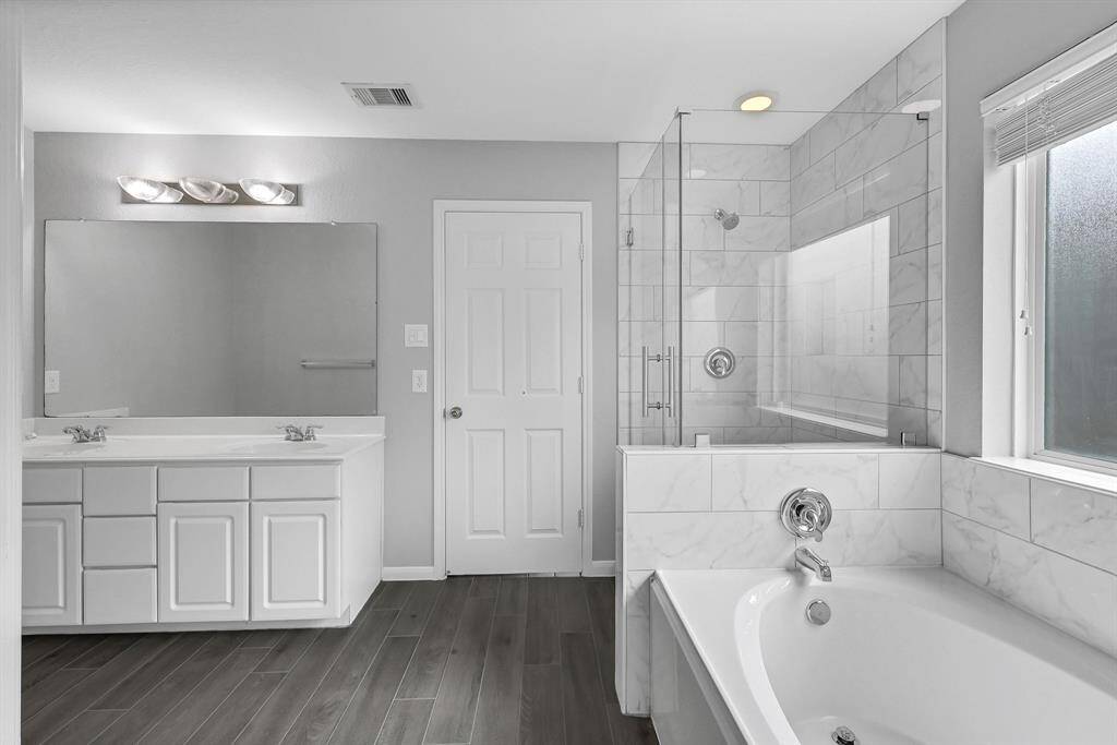 Convenient separate shower and battub in the primary bathroom