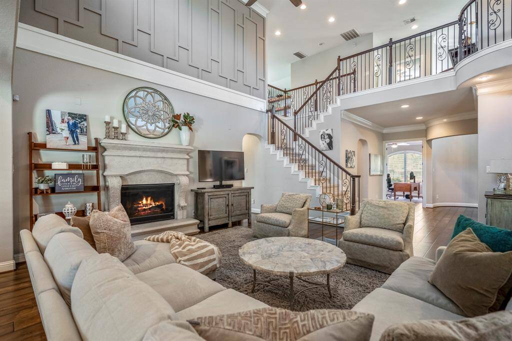 This stunning home could be in architectural digest, with elevated features such as the millwork, crown molding and cast stone fireplace.