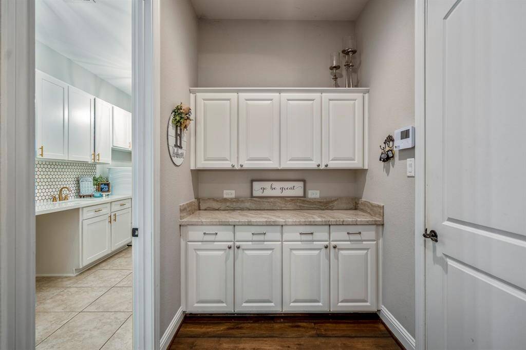 Enjoy a butler's pantry area where you can  store your dishes, serve your guests and / or create a beverage space when entertaining.