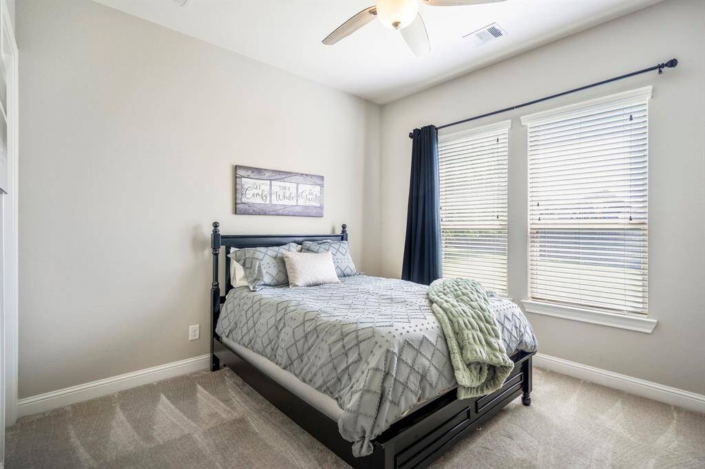 There are two bedrooms downstairs in this home, offering a stylish spot for your guest suite or to use as a nursery.