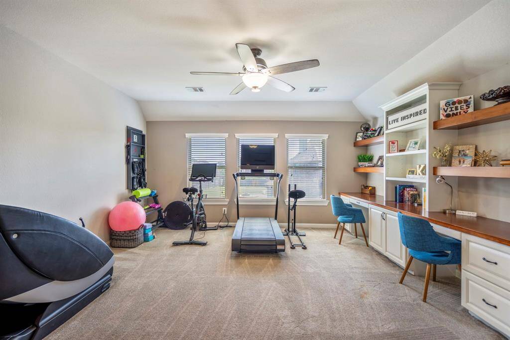 Upstairs you will find this huge gameroom with many variable options, including the dual desk areas.