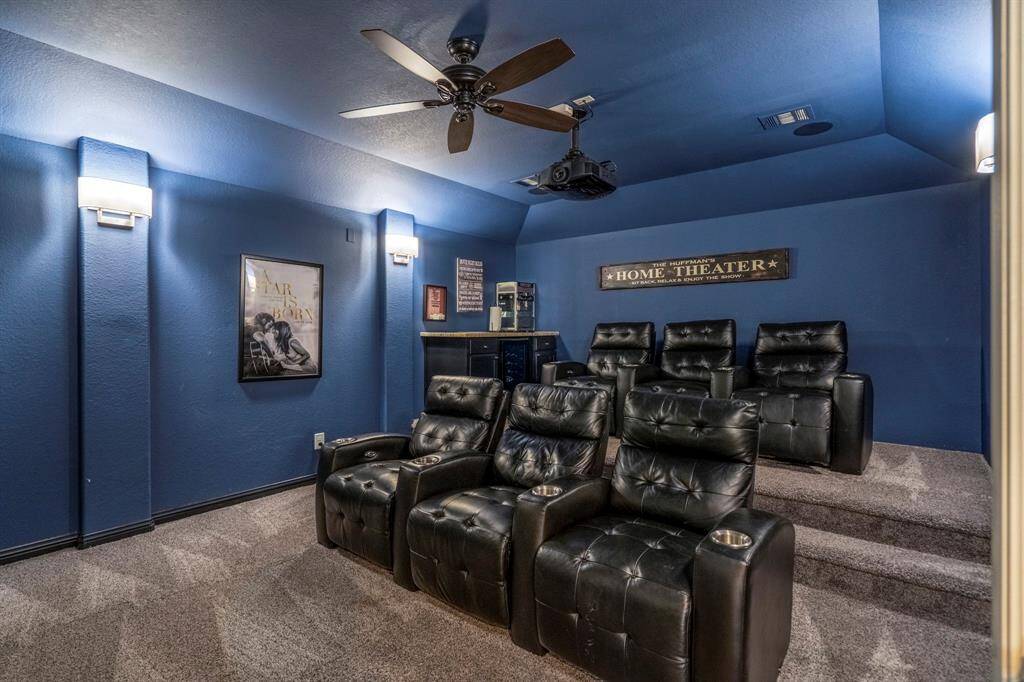 The home also features a huge media room with seating in a theater configuration.