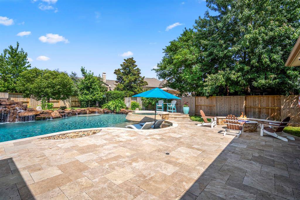 After spending the day in the pool, invite friends over to enjoy the fire pit, this one blends seamlessly into its surroundings.