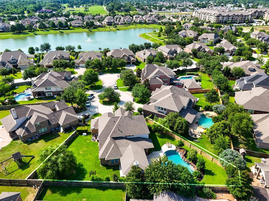 An aerial view of the property, surrounded by other beautiful properties, on a private cul-de-sac lot in the gated Northlake section of premier master planned community of Gleannloch Farms.  Simply a great place to live!