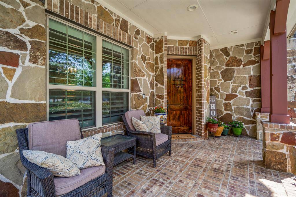 The semi-custom home has a stacked stone / stucco front elevation with a large inviting front porch.
