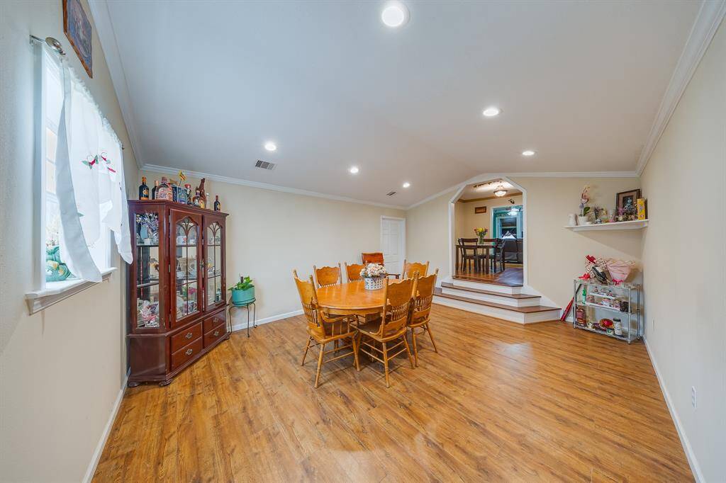 Bright dining space with step-up access to second living area—plenty of room for entertaining and holidays.