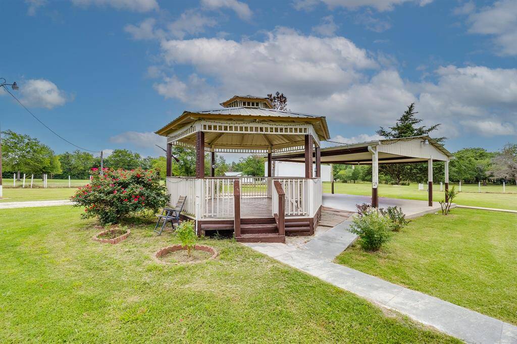 Gazebo and carport side-by-side for function and charm, just steps away from the home’s entrance.