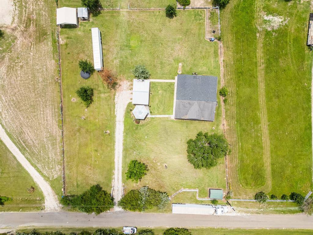 Overhead view displaying full property boundaries, structures, and spacious land usage.