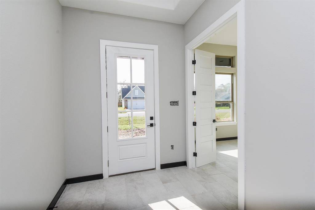 Open Entryway to Interior of Home showing off double doors to the Study!