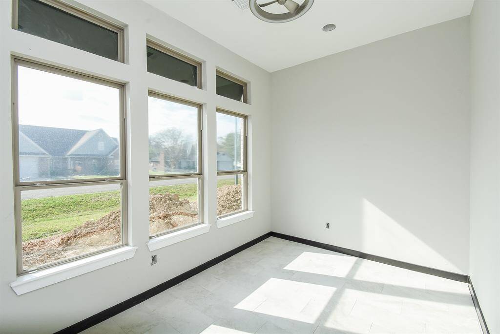 Office / Study has lhuge windows that allow lots of natural light