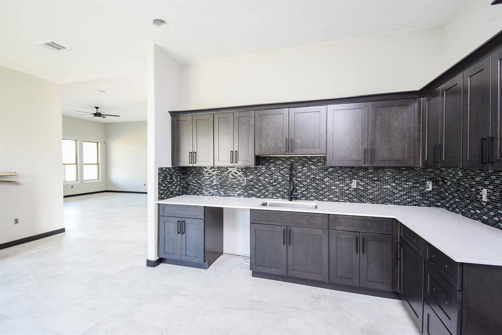 Kitchen and Breakfast area is huge!   Quartz counters and Lots of Cabinets and Counterspace and open area.
