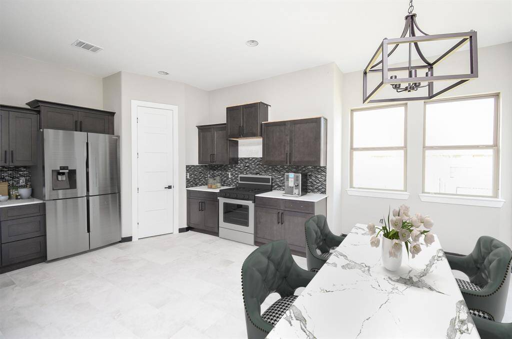 Kitchen and Breakfast area is huge!   Lots of Cabinets and Counterspace.  Virtually Staged Image of Appliances.  Built-in Appliances will be installed before closing.