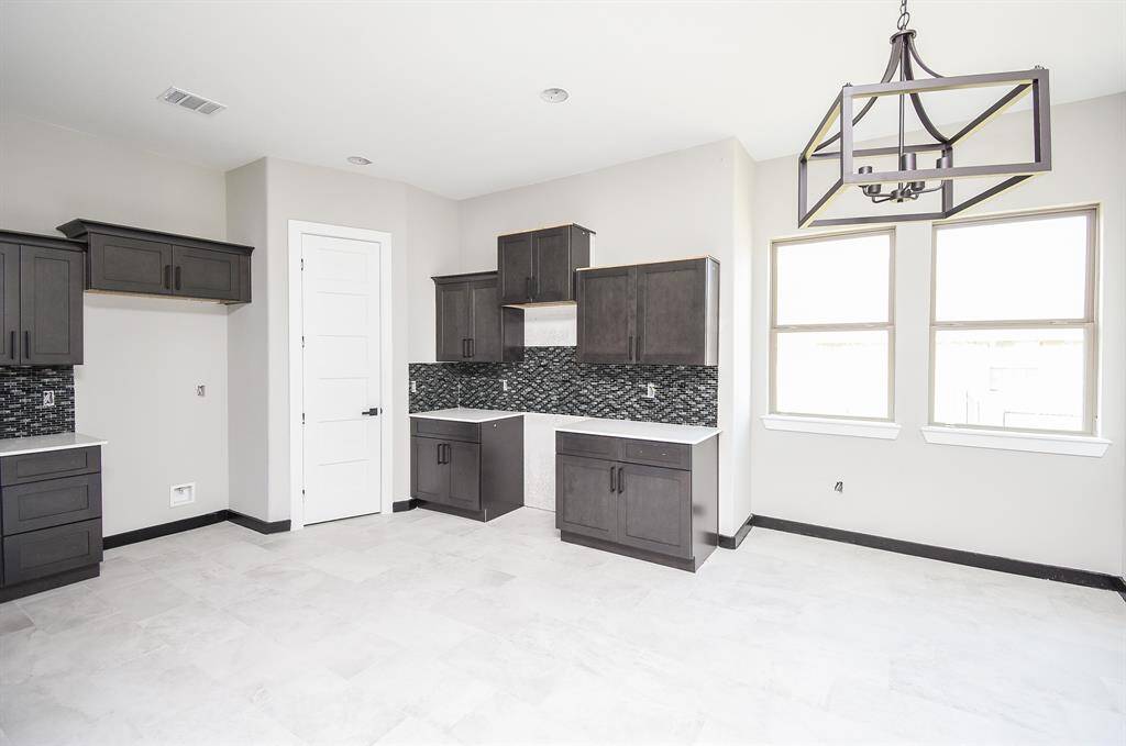 Kitchen and Breakfast area is huge!   Lots of Cabinets and Counterspace. Built-In appliances will be installed before closing.