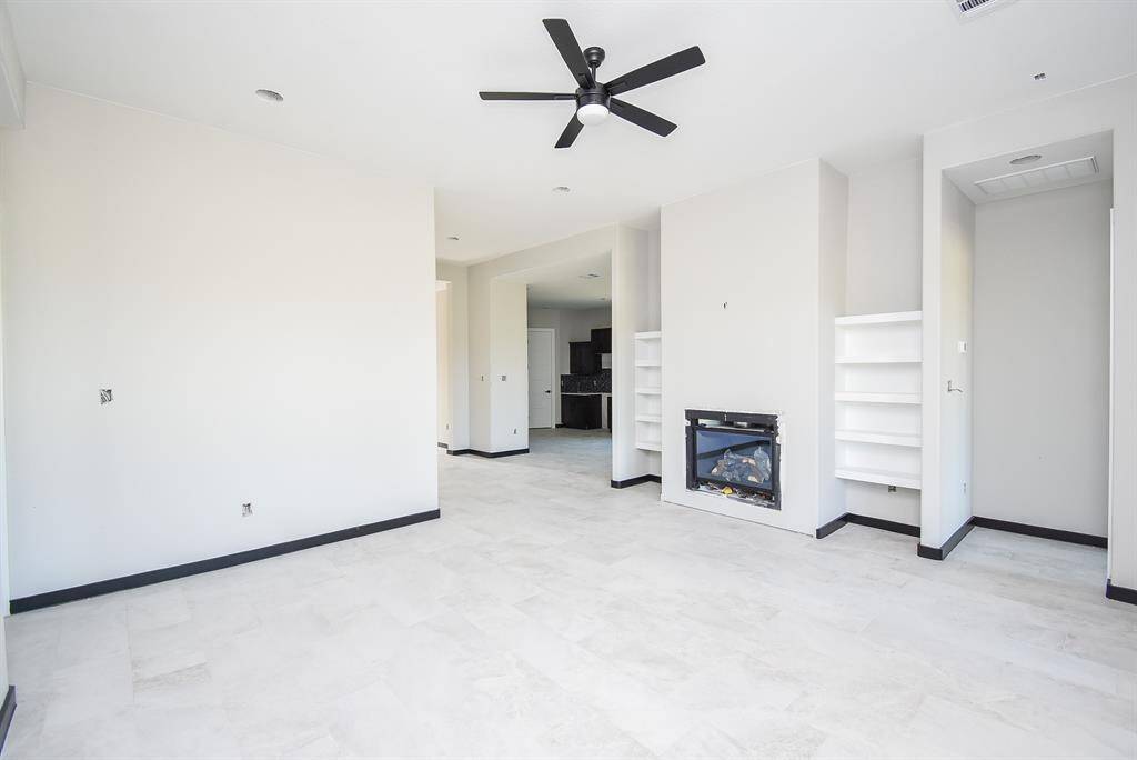 Family Room is huge with a fireplace and built-in shelves.