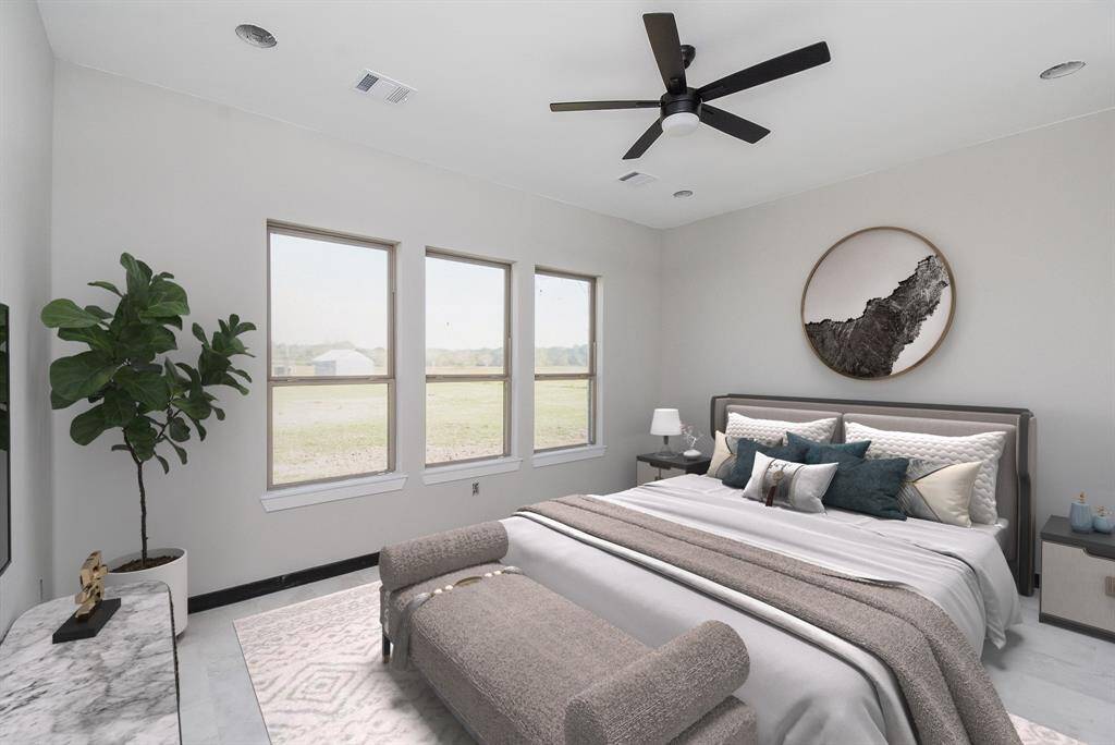 Primary Bedroom has lots of natural lighting with a view to the acreage out back. Virtually Staged Image