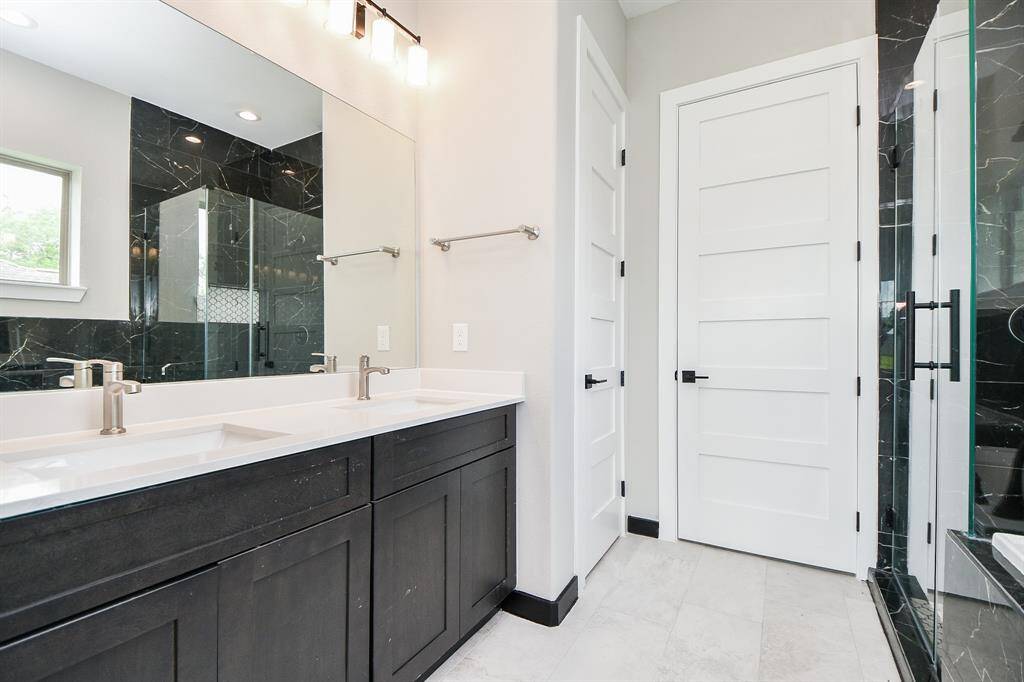 Primary Bath has Spa tub, large shower with floor to ceiling tiling!